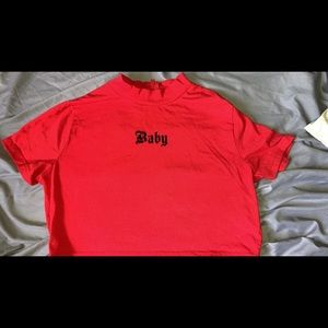 Red crop shirt with the word baby written on it